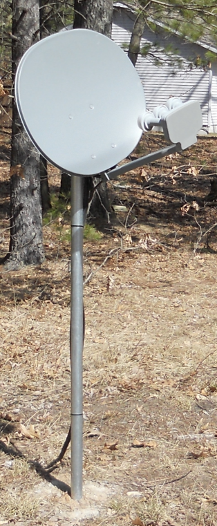 A much better idea: Satellite dish mounted on metal pole in concrete